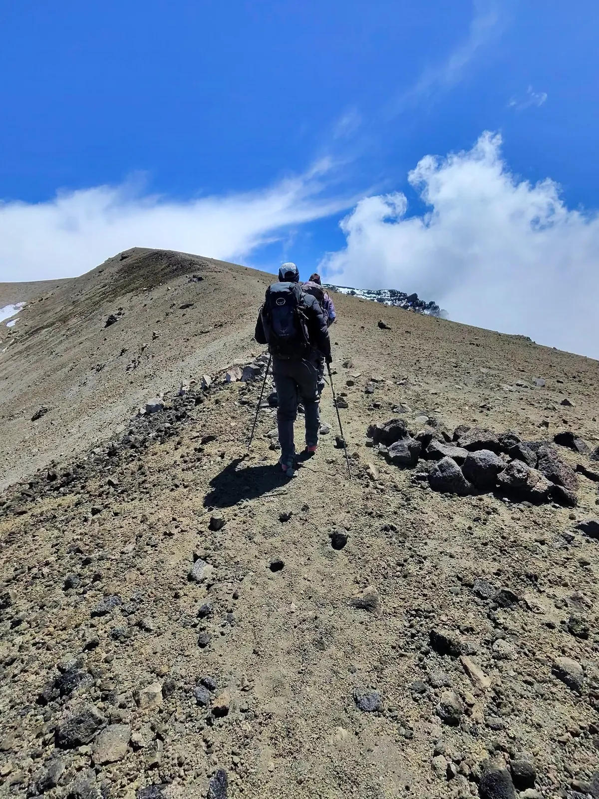 A climber ascending the summit ridge of Kilimanjaro