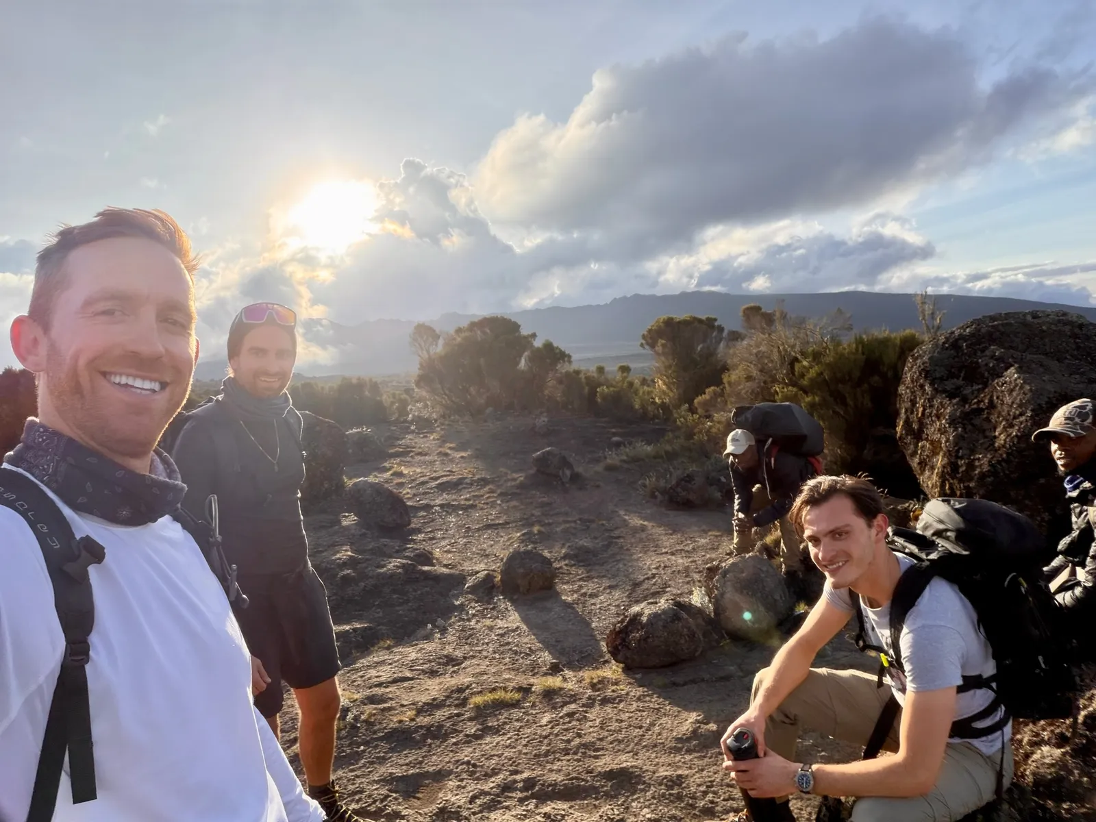 The group taking a break on the trail in golden light